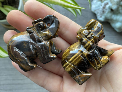 Pictured are various elephants carved out of tiger's eye.