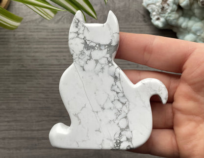 Pictured is a cat carved out of howlite.