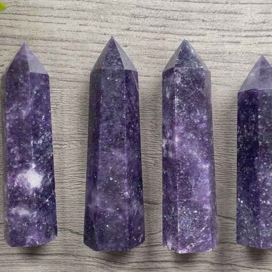 Pictured are various points of lepidolite.