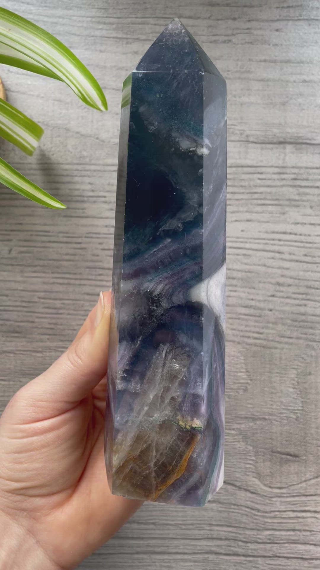 Pictured is a tower carved out of silky fluorite.